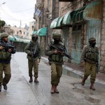 Israeli soldiers patrol in the West Bank city of Hebron, after a Palestinian youth was shot dead while trying to stab a soldier on October 29, 2015 (Photo: MENAHEM KAHANA/AFP/Getty Images)